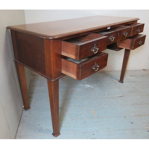 768 - A 19th century mahogany writing desk containing an array of five drawers with brass back handles & b... 