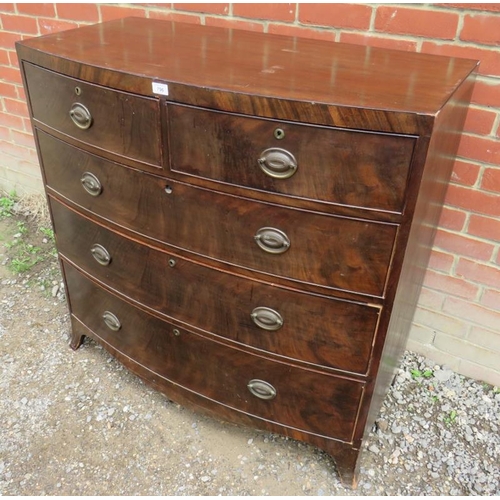 771 - A George III flame mahogany bow fronted chest of two short over three long graduated cock beaded dra... 