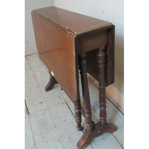 776 - An Edwardian mahogany octagonal Sutherland table raised on ring turned supports with outsplayed feet... 