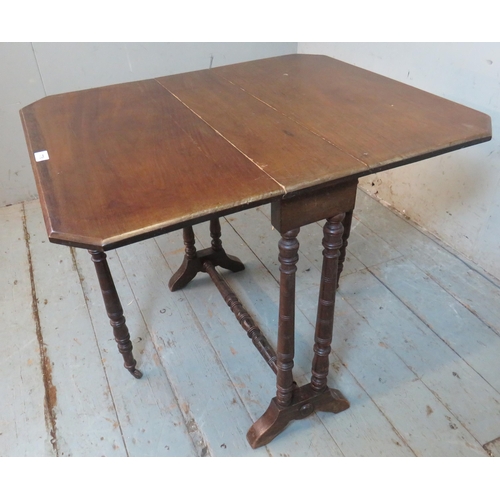 776 - An Edwardian mahogany octagonal Sutherland table raised on ring turned supports with outsplayed feet... 