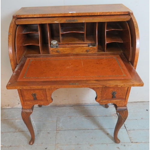 777 - An Edwardian Georgian revival burr walnut crossbanded cylinder topped desk with fitted interior & sa... 