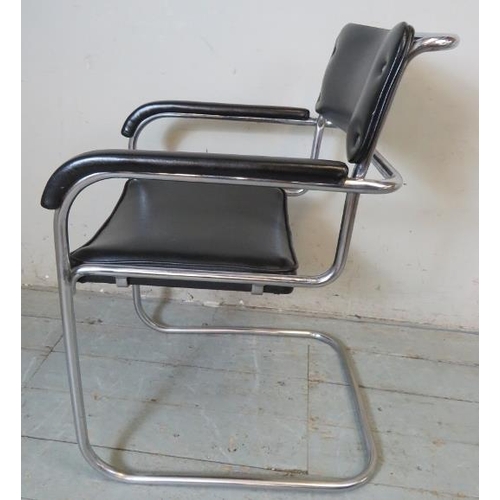 781 - A vintage mid century cantilever chrome framed desk chair upholstered in a black vinyl material.
82c... 