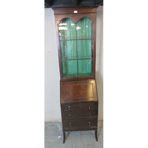 784 - An Edwardian mahogany narrow bureau/display cabinet, the fall front opening onto a fitted interior, ... 