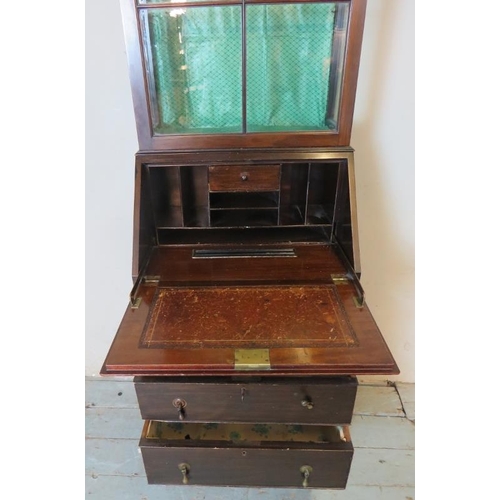 784 - An Edwardian mahogany narrow bureau/display cabinet, the fall front opening onto a fitted interior, ... 