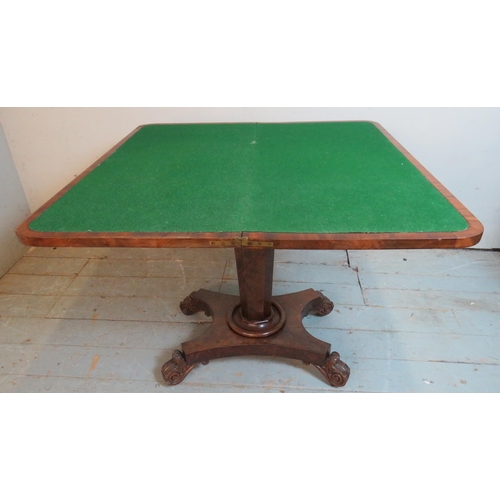 788 - A Victorian mahogany turn over card table with carved & scrolled frieze, raised on a tapering octago... 