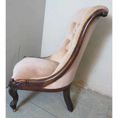 791 - A Victorian rosewood framed button back slipper chair with a scrolled back upholstered in a  light p... 