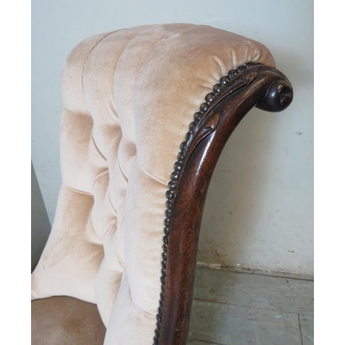 791 - A Victorian rosewood framed button back slipper chair with a scrolled back upholstered in a  light p... 