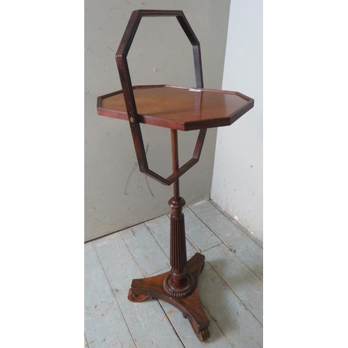 795 - An unusual Regency mahogany & rosewood height adjustable tea table, the octagonal top encircled by a... 