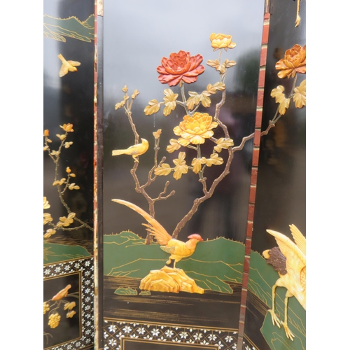 800 - A vintage Japanese seven section folding screen, ornately decorated with mother of pearl inlay and w... 