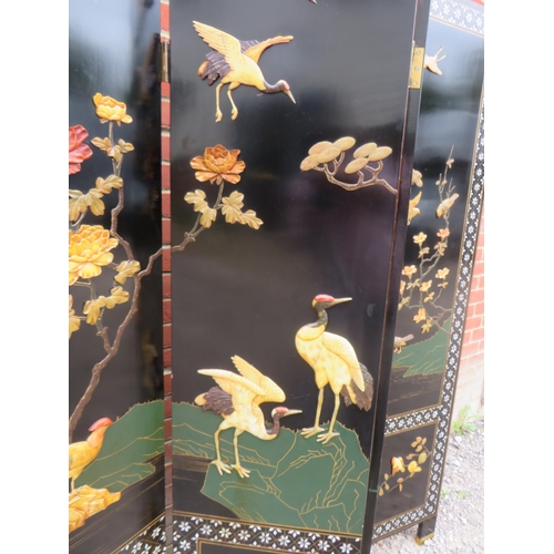 800 - A vintage Japanese seven section folding screen, ornately decorated with mother of pearl inlay and w... 