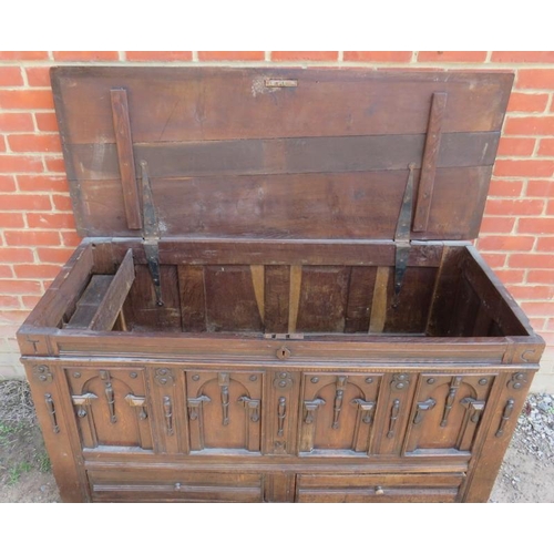 802 - A late 17th century oak mule chest with double fold carving & fielded panels to front and sides, emb... 