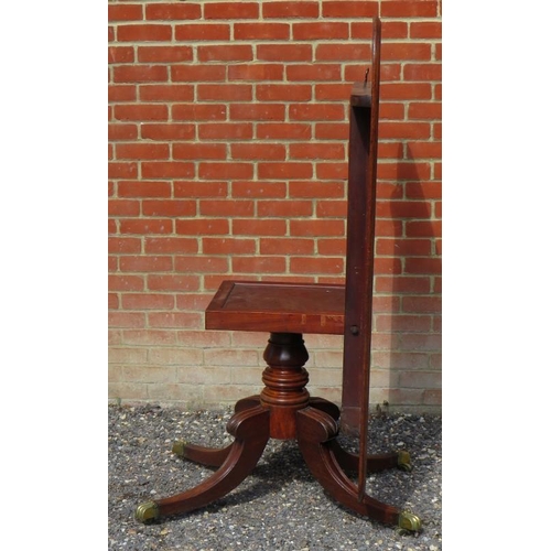 810 - A Regency mahogany rectangular tilt top breakfast table, with a turned pedestal raised on four sabre... 