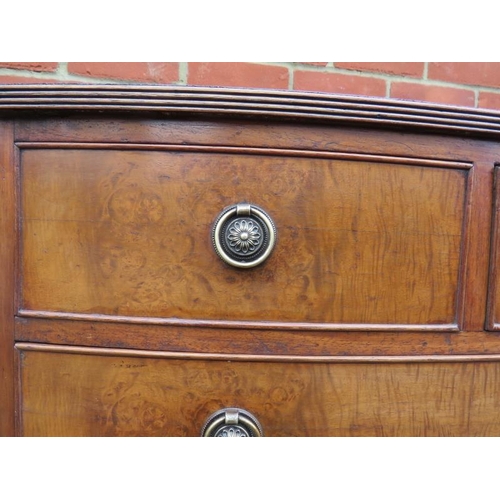 814 - A small reproduction Georgian style walnut veneer bow front chest of two short over three long cock ... 