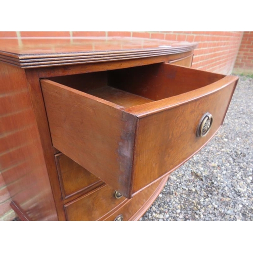 814 - A small reproduction Georgian style walnut veneer bow front chest of two short over three long cock ... 