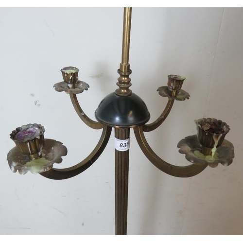 817 - A 19th century brass floor standing four branch candelabra, with a fluted column terminating on a ci... 