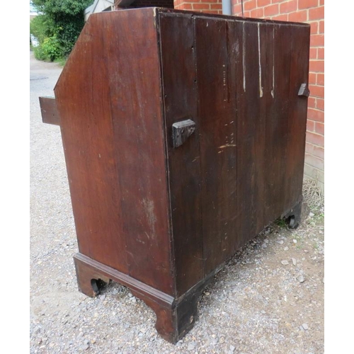 818 - A George III flame mahogany bureau with the fall front revealing a interior and two short over three... 