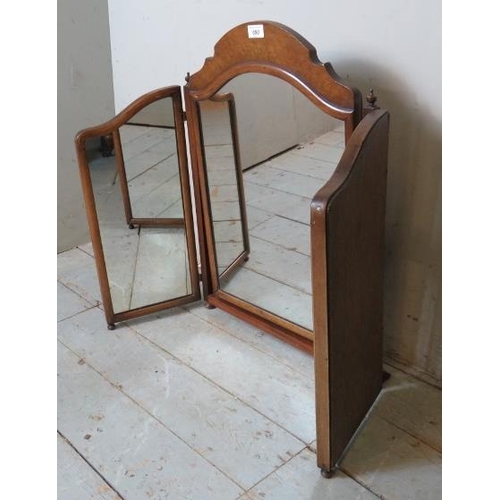 825 - An Edwardian mahogany three section folding swing vanity/table top mirror, surmounted by a walnut ve... 