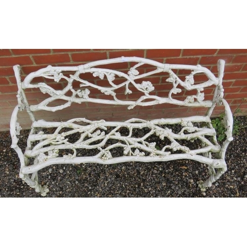 844 - A 19th century white painted cast iron garden bench in the manner of Coalbrookdale, depicting branch... 