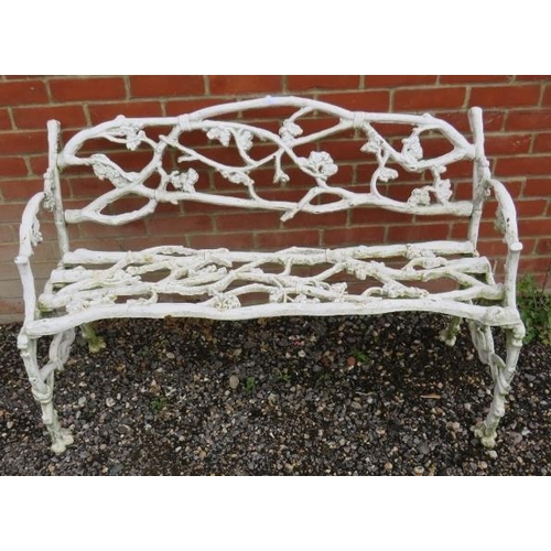 844 - A 19th century white painted cast iron garden bench in the manner of Coalbrookdale, depicting branch... 