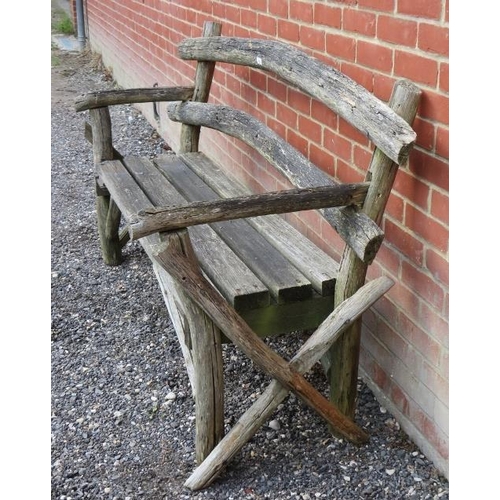 846 - A rustic nicely weathered garden bench with slatted seat and naturalistic back rest and end sections... 