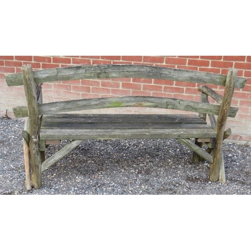 846 - A rustic nicely weathered garden bench with slatted seat and naturalistic back rest and end sections... 