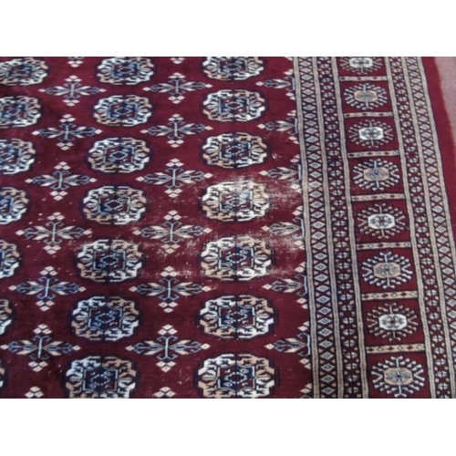 907 - A 20th century part silk Persian carpet on claret ground, slightly a/f, (72