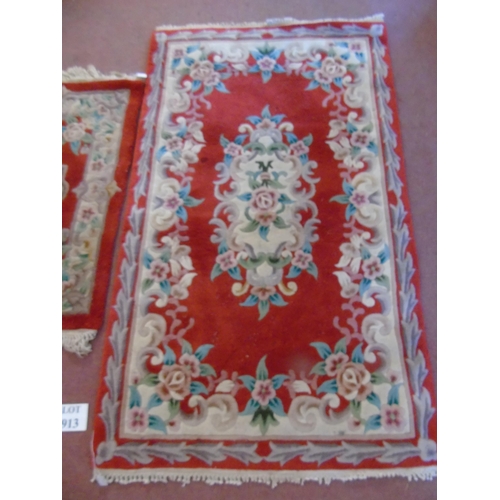 913 - A trio of Chinese rugs on red ground. 160cm x 93cm, 120cm x 63cm and 95cm x 62cm.
Estimated: £30-£50... 