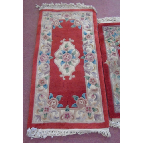 913 - A trio of Chinese rugs on red ground. 160cm x 93cm, 120cm x 63cm and 95cm x 62cm.
Estimated: £30-£50... 