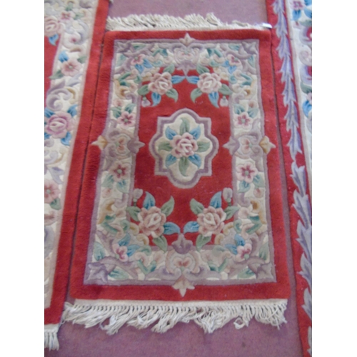 913 - A trio of Chinese rugs on red ground. 160cm x 93cm, 120cm x 63cm and 95cm x 62cm.
Estimated: £30-£50... 