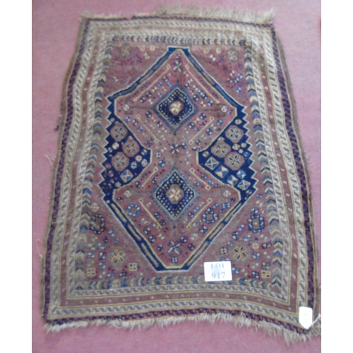 917 - An early 20th century Persian rug on brown ground, slightly a/f, 3.5' x 4.5' approx.
Estimated: £30-... 