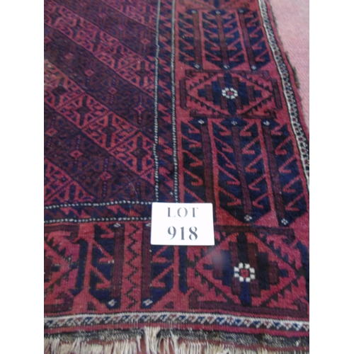 918 - An early 20th Century Persian rug on burgundy ground (even wear). 100cm x 190cm.
Estimated: £30-£50.