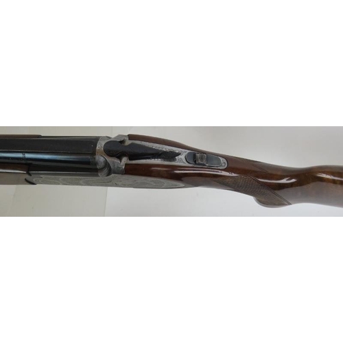 932 - A Rizzini 12 bore over-and-under multichoke, ejector, with game scene to action, 27.5