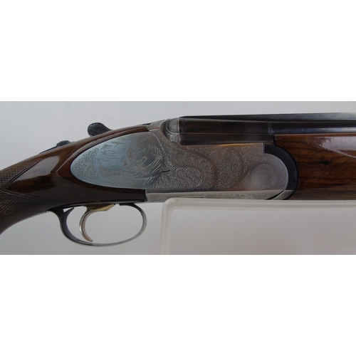 932 - A Rizzini 12 bore over-and-under multichoke, ejector, with game scene to action, 27.5