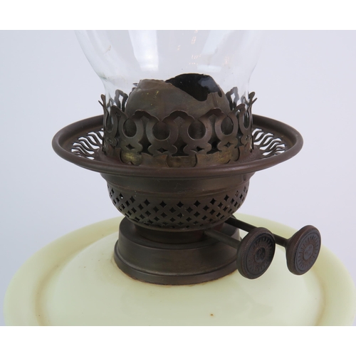 36 - A Victorian cast iron based oil lamp with hand decorated glass reservoir and spare chimney. Overall ... 