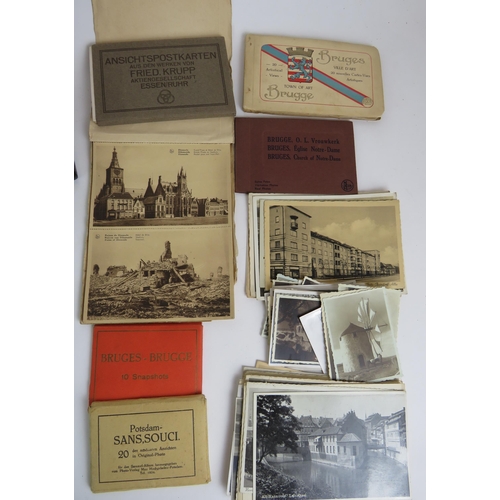 44 - A collection of post WWI postcards, a Smiths oak cased mantel clock, a pewter hip flask, a cigarette... 