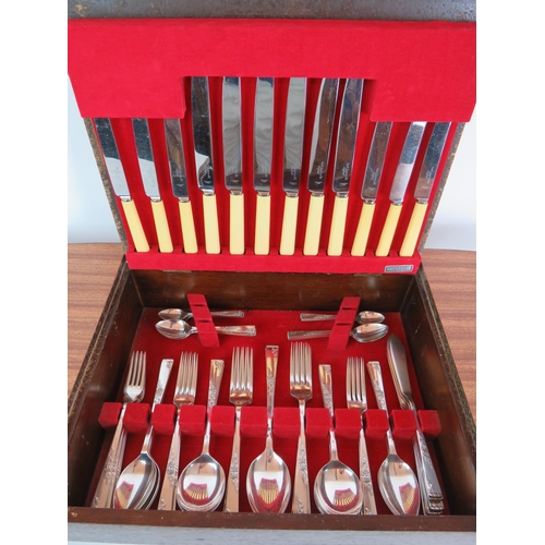 52 - A very cool mid Century Smith Seymour 58 piece canteen of cutlery in a bespoke table style canteen w... 