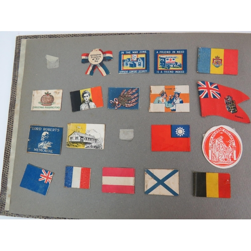 53 - Two albums containing a fascinating collection of charity flag day flags including many WWI and WW2 ... 