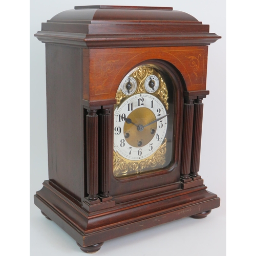 62 - An early 20th Century inlaid mahogany mantle clock with striking and chiming Junghans movement. No k... 