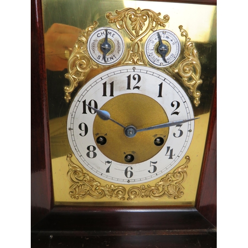 62 - An early 20th Century inlaid mahogany mantle clock with striking and chiming Junghans movement. No k... 