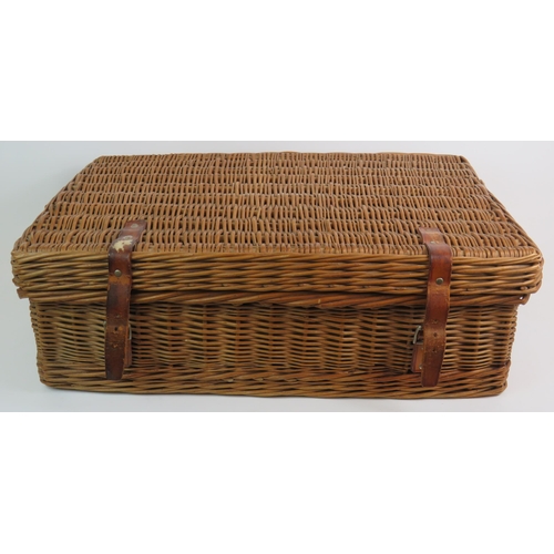 64 - A vintage Harrods Coracle whicker picnic basket fully fitted with six place settings and various con... 