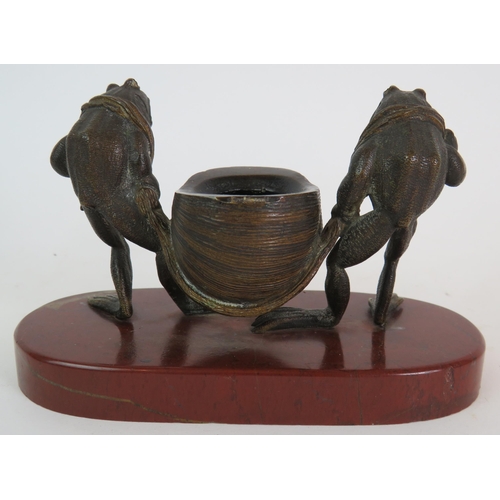 70 - An antique Anthropomorphic bronze inkwell set featuring two frogs carrying a snail shell accompanied... 