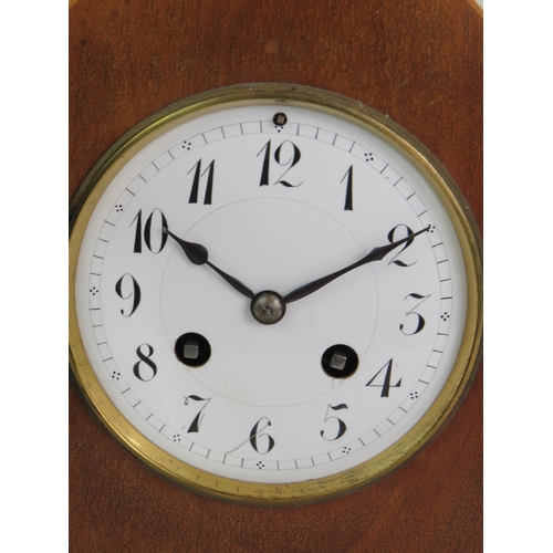 81 - A late 19th Century walnut cased striking mantel clock of arched form with gilt brass fittings. Fren... 