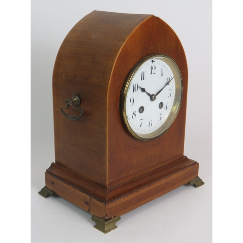 81 - A late 19th Century walnut cased striking mantel clock of arched form with gilt brass fittings. Fren... 