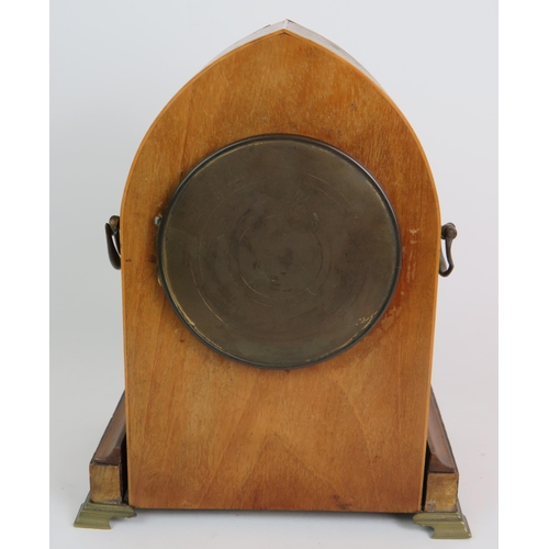 81 - A late 19th Century walnut cased striking mantel clock of arched form with gilt brass fittings. Fren... 