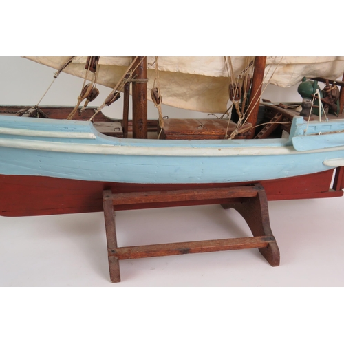 82 - A vintage scale model of a three masted schooner in full sail on separate stand. Height 92cm, length... 