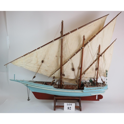 82 - A vintage scale model of a three masted schooner in full sail on separate stand. Height 92cm, length... 