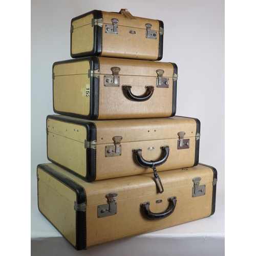 83 - A vintage four piece Victor Luggage travelling set including vanity case and hanging rail. All fully... 