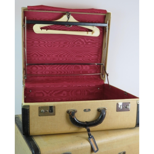 83 - A vintage four piece Victor Luggage travelling set including vanity case and hanging rail. All fully... 