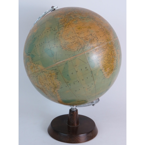 85 - A Phillips' 13.5'' terrestrial Globe dated 1958 on turned wood stand. Overall height 47cm. Condition... 