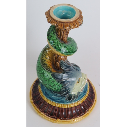 98 - A 19th Century Minton Majolica candlestick in the form of a wrythen stylised dolphin. Height 21cm. C... 